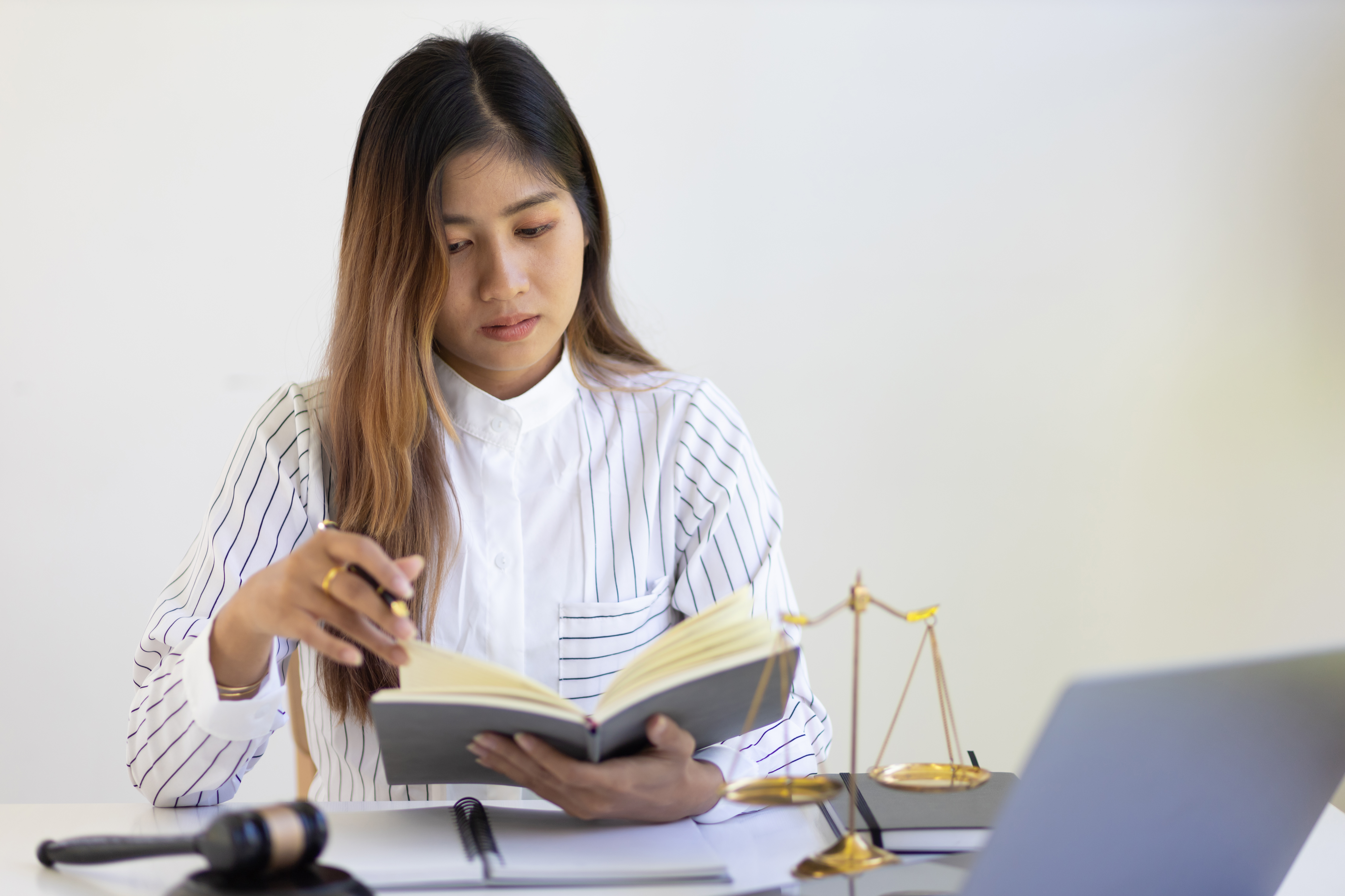 Female lawyer working in a law firm. Concept of Justice and Legal Judgment