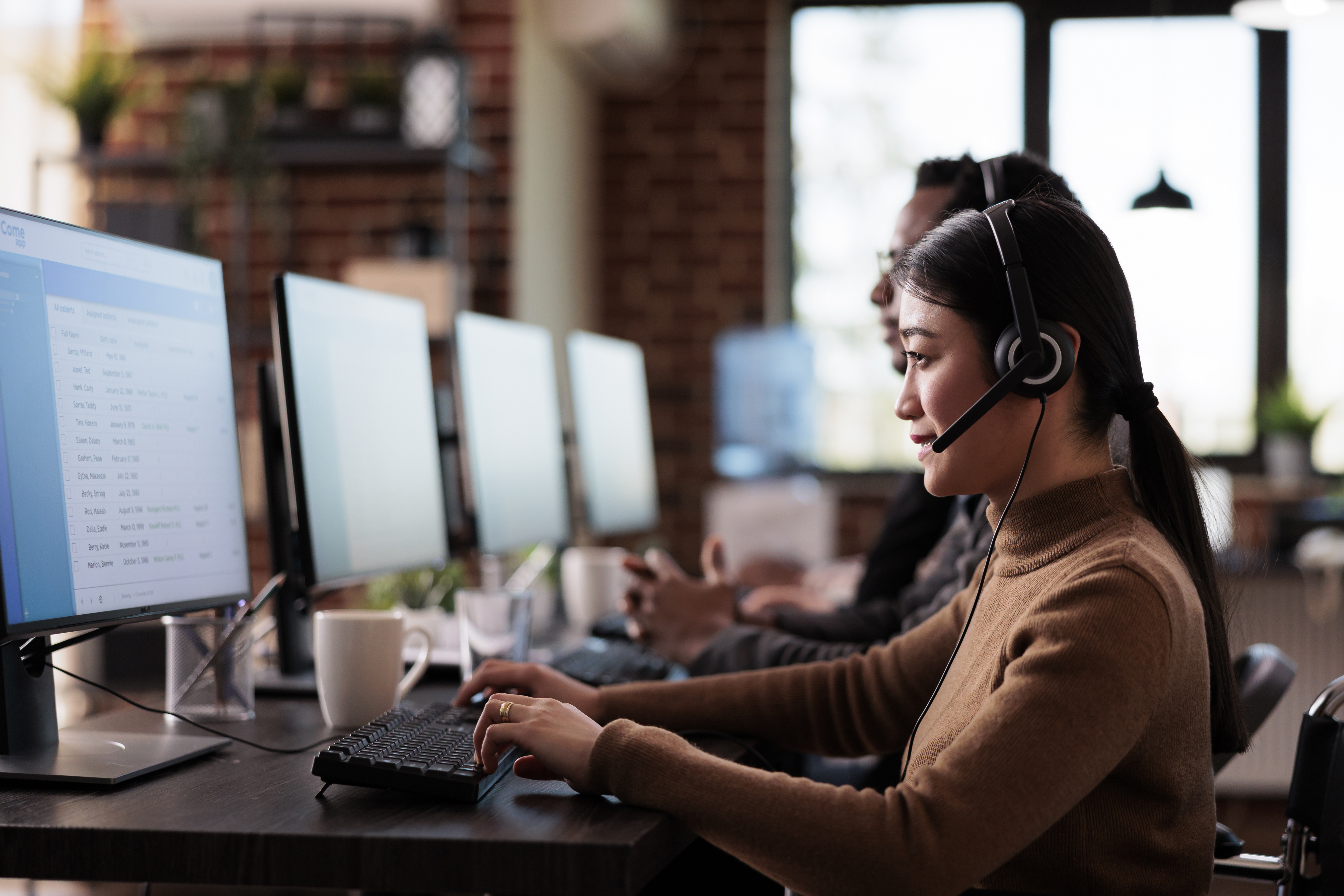 Paralyzed asian employee working at call center reception